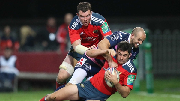 Felix Jones (holding ball) has been ruled out of Munster's clash with Glasgow next Friday