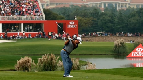 Graeme McDowell hits into the 18th after an impressive third round in Shanghai