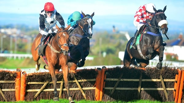 Oscar Fortune ridden by Tony McCoy (l) goes on to win the Mr & Mrs Handley Ruby Wedding Novices' Hurdle