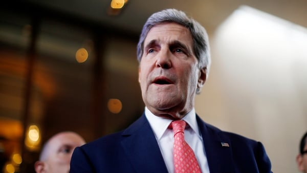 John Kerry speaks to the media after his arrival at the talks in Geneva