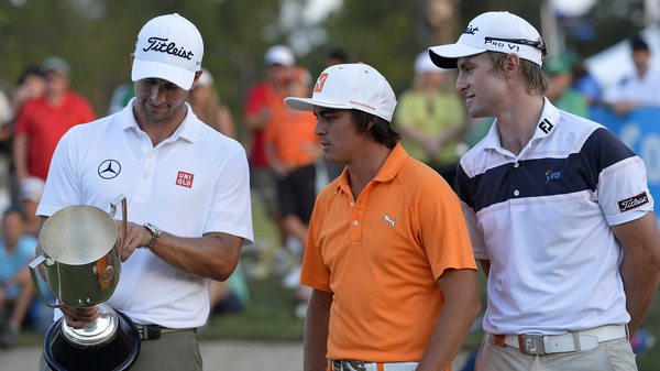 Adam Scott, Rickie Fowler and Jack Wilson share a moment after Adam Scott is presented with the winners trophy