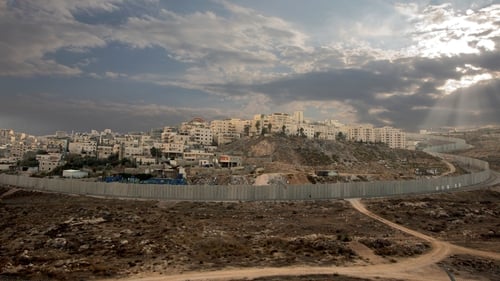 Israel's controversial separation barrier surrounds the Ras Khamis neighbourhood of East Jerusalem