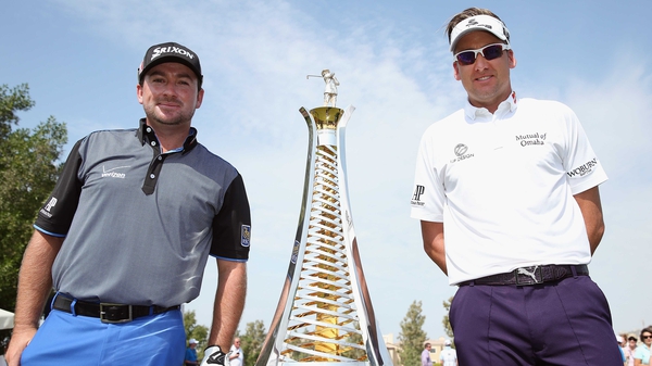 Graeme McDowell (L) and Ian Poulter of England with the Race To Dubai trophy