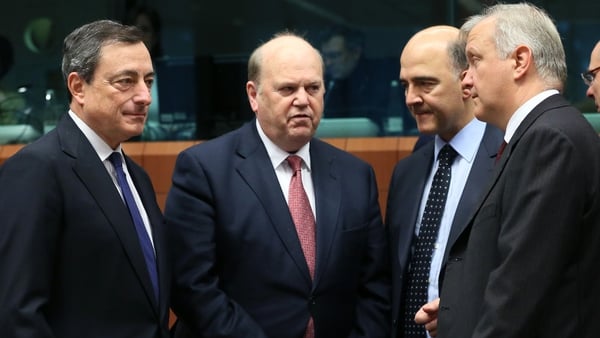 (L-R) ECB President Mario Draghi, Michael Noonan, French finance minister Pierre Moscovici and Olli Rehn at the meeting of eurozone finance ministers