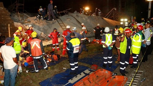Rescue workers searched the rubble of a half-built mall that collapsed in Tongaat