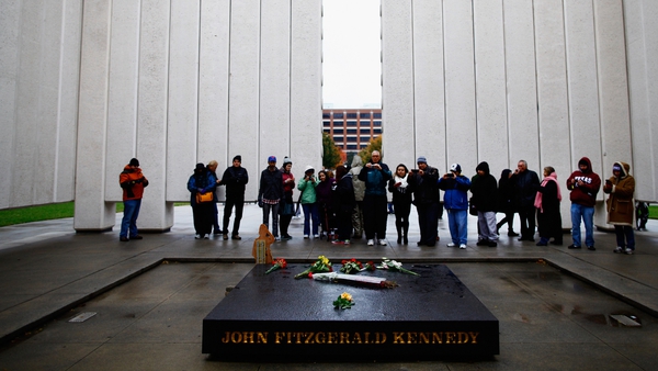 People visit the John F. Kennedy Memorial Plaza in Dallas, Texas