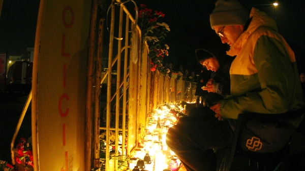Mourners leave candles outside Maxima supermarket in Riga where the roof collapsed killing at least 54