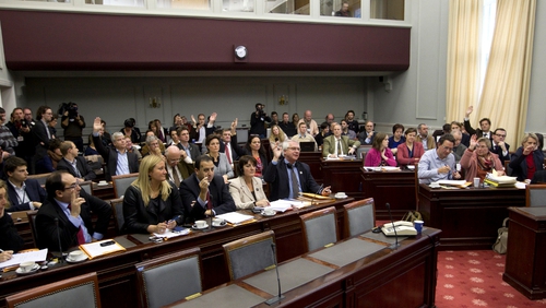 Belgium's Senate members vote during a session of the Senate's justice and social affairs commission on the expansion of the euthanasia law for minors