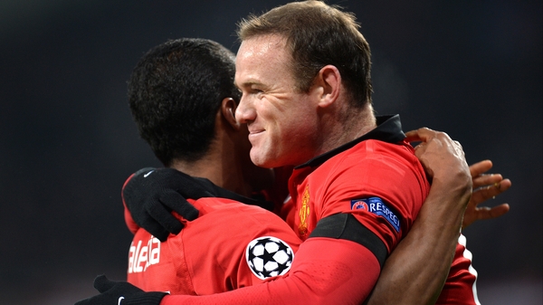 Opening goalscorer Antonio Valencia celebrates with Wayne Rooney