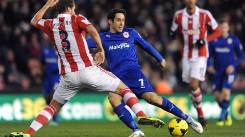 Cardiff's Peter Whittingham has a shot blocked by Erik Pieters of Stoke