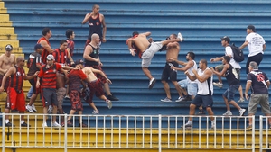Violence broke out between rival fans at a game in the Brazilian championship yesterday