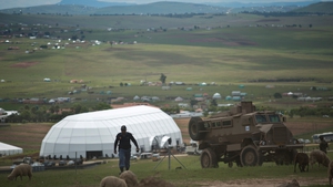 South African security forces patrol the area around Qunu
