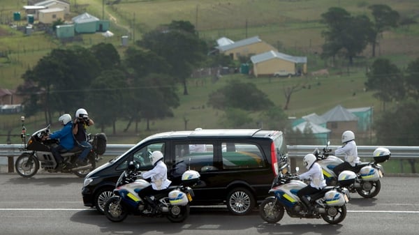 The hearse carrying the remains of South Africa's first black president rolled with a police escort