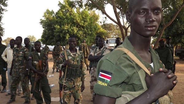 A group of South Sudanese soldiers patrol the streets of Juba amid serious unrest there in recent weeks