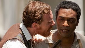 Michael Fassbender and Chiwetel Ejiofor as Solomon Northup in 12 Years a Slave