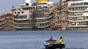 The wreck of the Costa Concordia lies in the port of Giglio two years after capsizing
