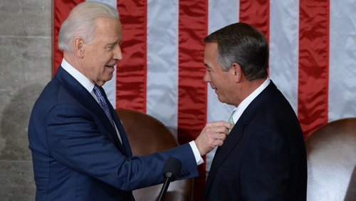 US Vice President Joe Biden (L) confers with House Speaker John Boehner (R), prior to address