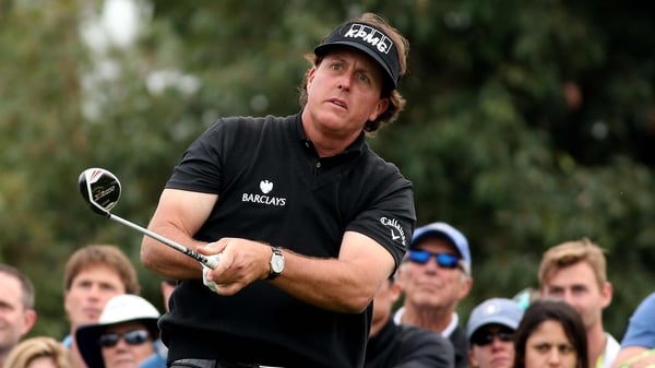 Phil Mickelson is going to battle past a back injury to defend his title