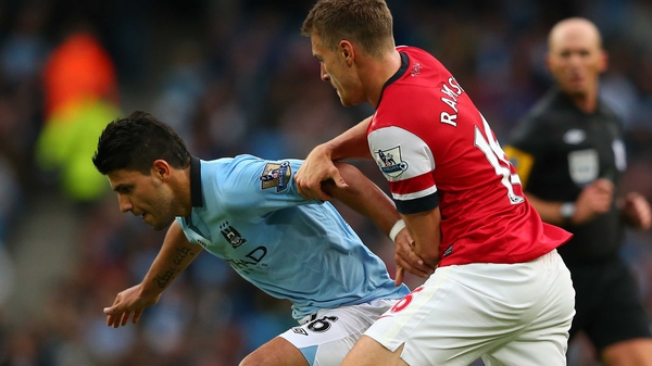 Sergio Aguero (l) and Aaron Ramsey are set to miss a crucial period in the race for the Premier League title