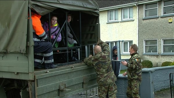 Defence Forces evacuate people in flooded areas