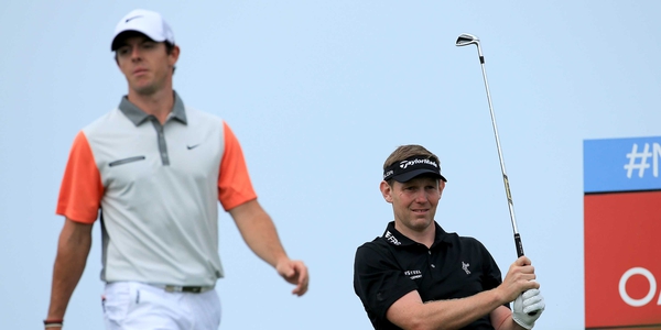 Stephen Gallacher and Rory McIlroy in action on the final day of the Dubai Desert Classic