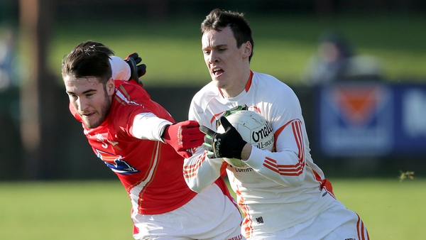 Patrick Reilly of Louth tackles Mark Shields of Armagh