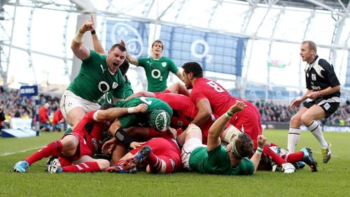 Cian Healy celebrates Chris Henry's try against Wales