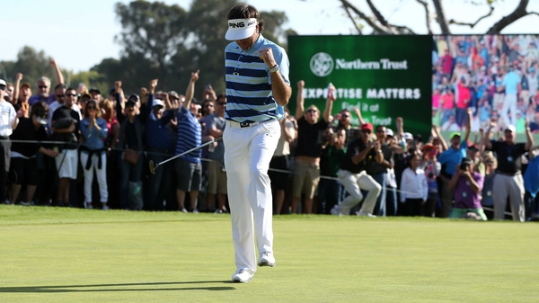 Bubba Watson celebrates his birdie putt on the 18th green to win the Northern Trust Open