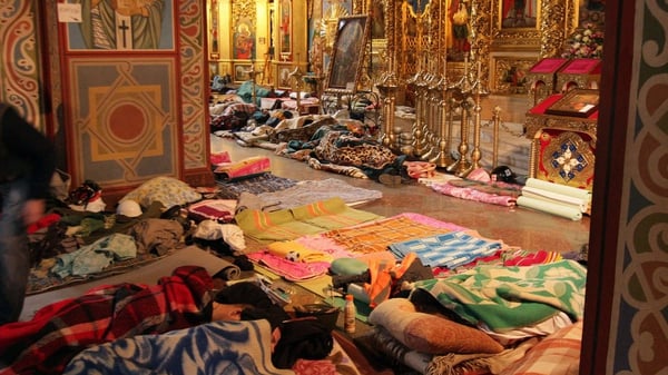 Wounded protesters lie on the floor of St Michael's