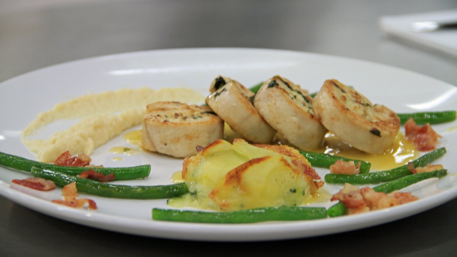 Stuffed ballotine of Chicken with potato + Courgette gratin, celeriac