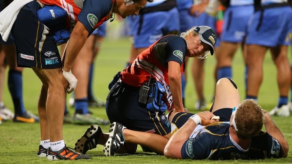 David Pocock receives medical attention after injuring his knee playing for the Brumbies against the Western Force