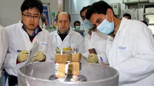 A team from the International Atomic Energy Agency checks the enrichment process inside a uranium enrichment plant in central Iran