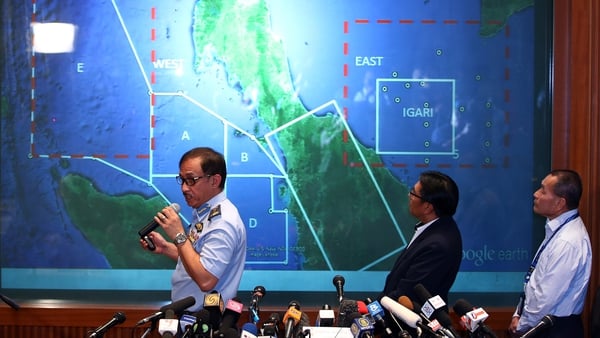 Officials identify the search area at a media briefing in Kuala Lumpur