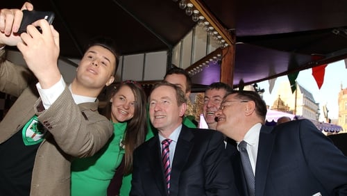 Taoiseach Enda Kenny has a 'selfie' taken with Fabian Bohan-Taghian outside the town hall in Manchester