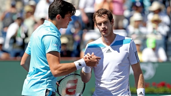 Andy Murray (l) shakes hands with winner Milos Raonic