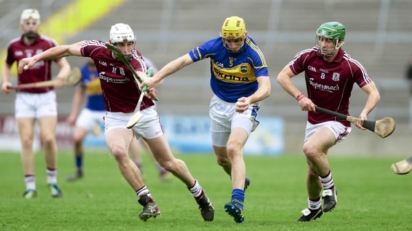 Tipp's Shane McGrath comes under pressure from Gearoid McInerney and David Burk