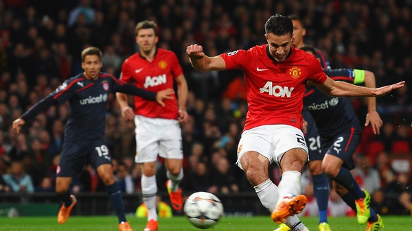 Robin van Persie scores the opening goal from a penalty kick