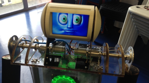 Robbie The Robot can be moved around using a computer, and can pick up small objects from the floor
