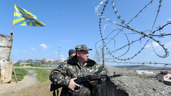 Ukrainian soldiers patrol at the Belbek airbase not far from the Crimean city of Sevastopol