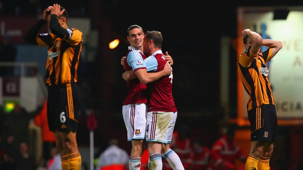 West Ham's Andy Carroll and Kevin Nolan celebrate after James Chester's own goal for West Ham