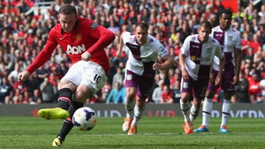 Wayne Rooney scores a penalty, his second goal for Manchester United