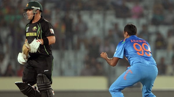 India bowler Ravichandran Ashwin celebrates after taking the wicket of Australia's Aaron Finch
