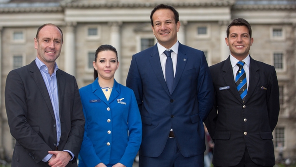 Ryanair chief marketing officer Kenny Jacobs, cabin crew member Daniela Sopkova, Transport Minister Leo Varadkar and cabin crew member Federico Galli