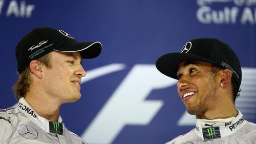 Nico Rosberg (L) outdid his McClaren team-mate Lewis Hamilton for pole position tomorrow