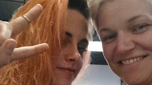Kristen Stewart debuts her new orange hair colour with her hair stylist at Maison de Cheveux in New Orleans