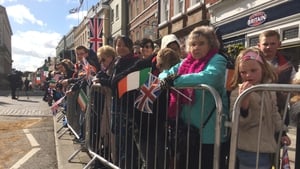 Flags aplenty as people wait for the royal procession