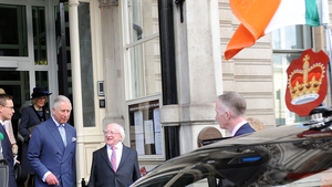 Prince Charles and President Higgins leave the Embassy en route to Windsor