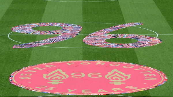 The number 96, made up of fans scarves, filled the centre circle at Anfield
