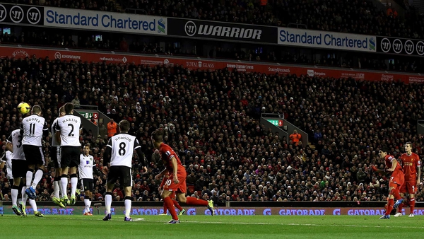 Luis Suarez scores from a free-kick against the Canaries in December