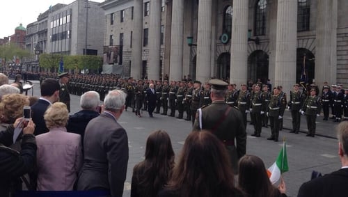 President Higgins inspects the Guard of Honour at the GPO